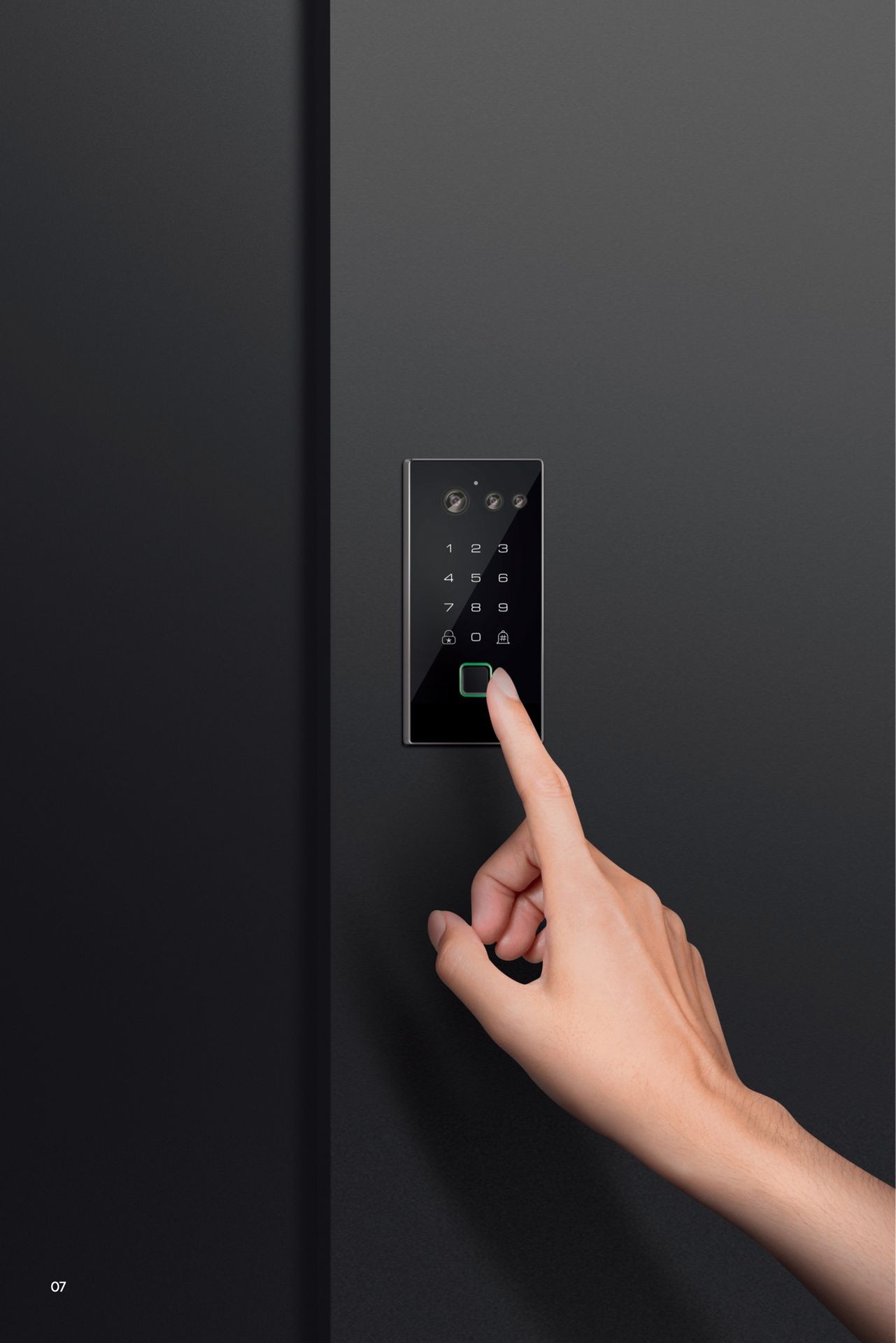 Close-up of a hand pressing a button on a black electronic keypad with illuminated numbers and icons.